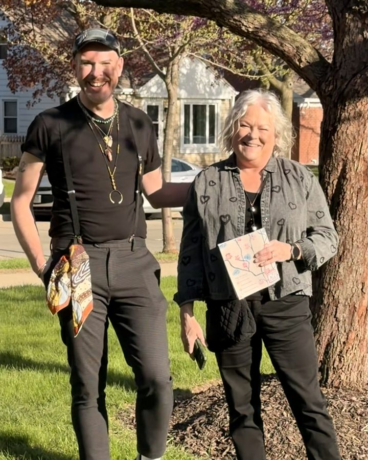 Aaron and his mom, Darla, laughing under a tree in spring