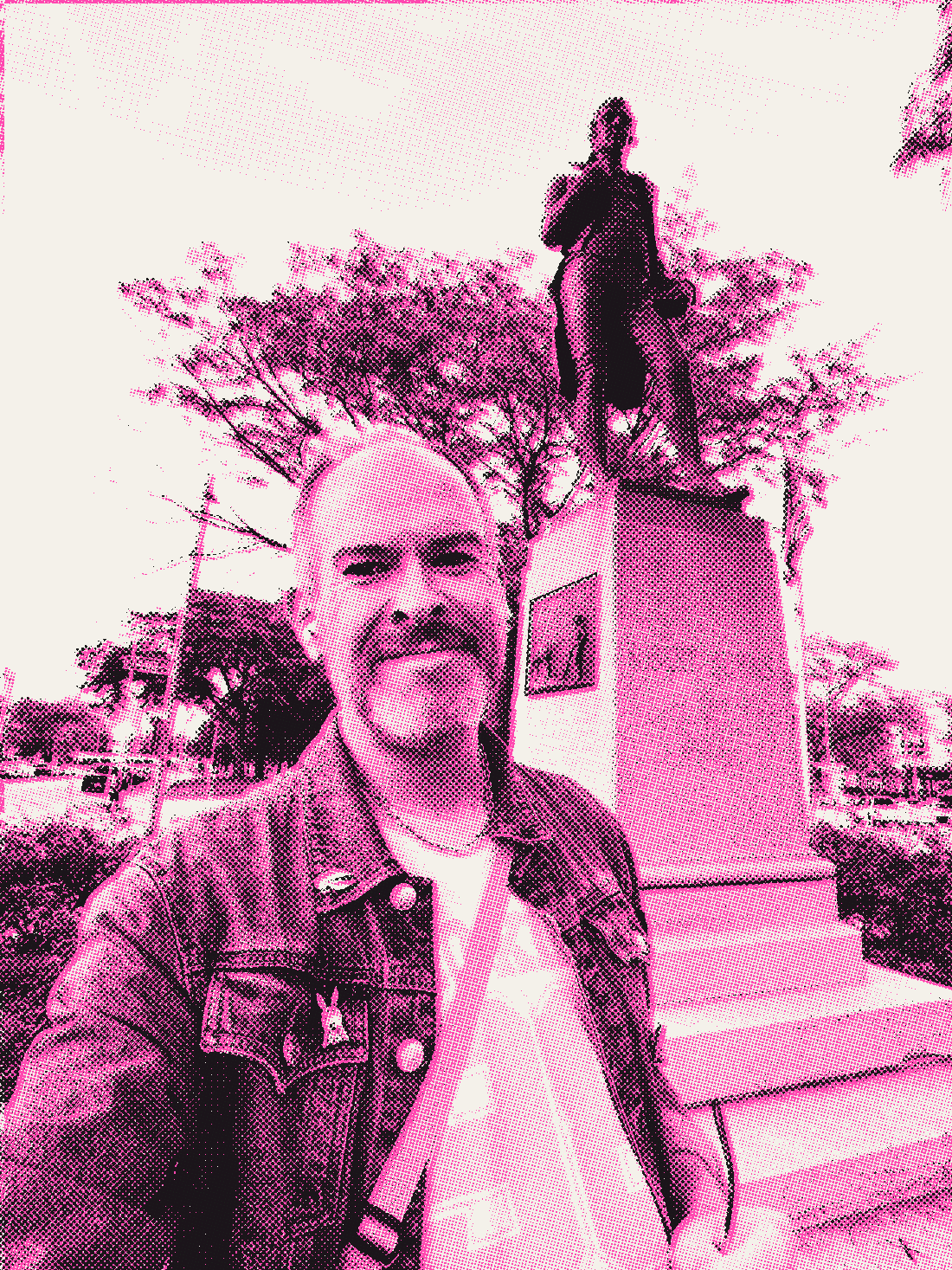 Aaron in front of the Robert Burns statue, smiling