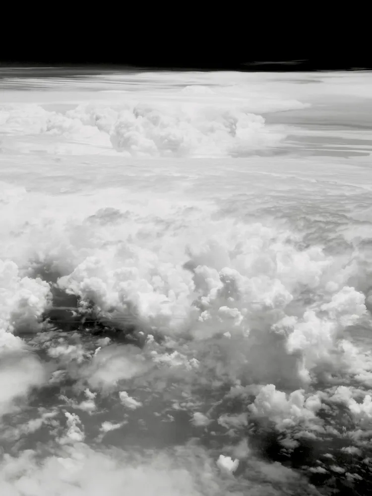 Clouds from the plane window in black and white
