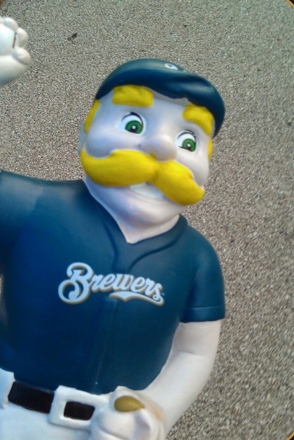 A Bernie Brewer figurine in a Brewers jersey, waving