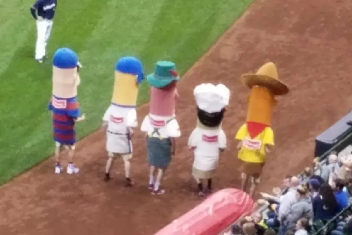 The Brewers sausage race mascots on the warning track
