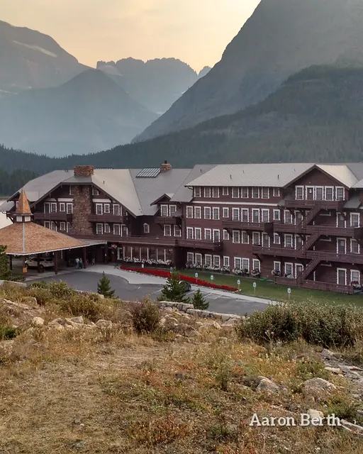 A historic lodge below hazy mountains in Montana