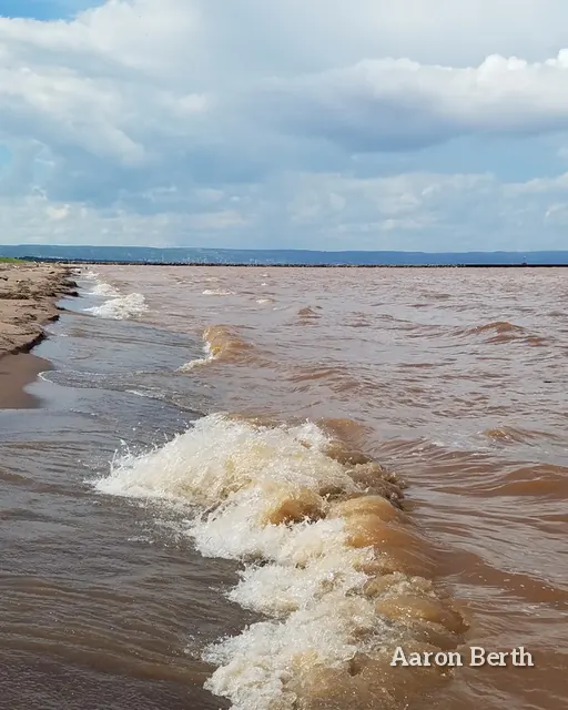 Brown surf rolling onto a Lake Superior beach