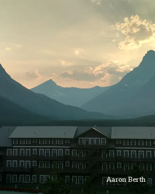 Mountain peaks at golden hour above a lodge in Glacier National Park