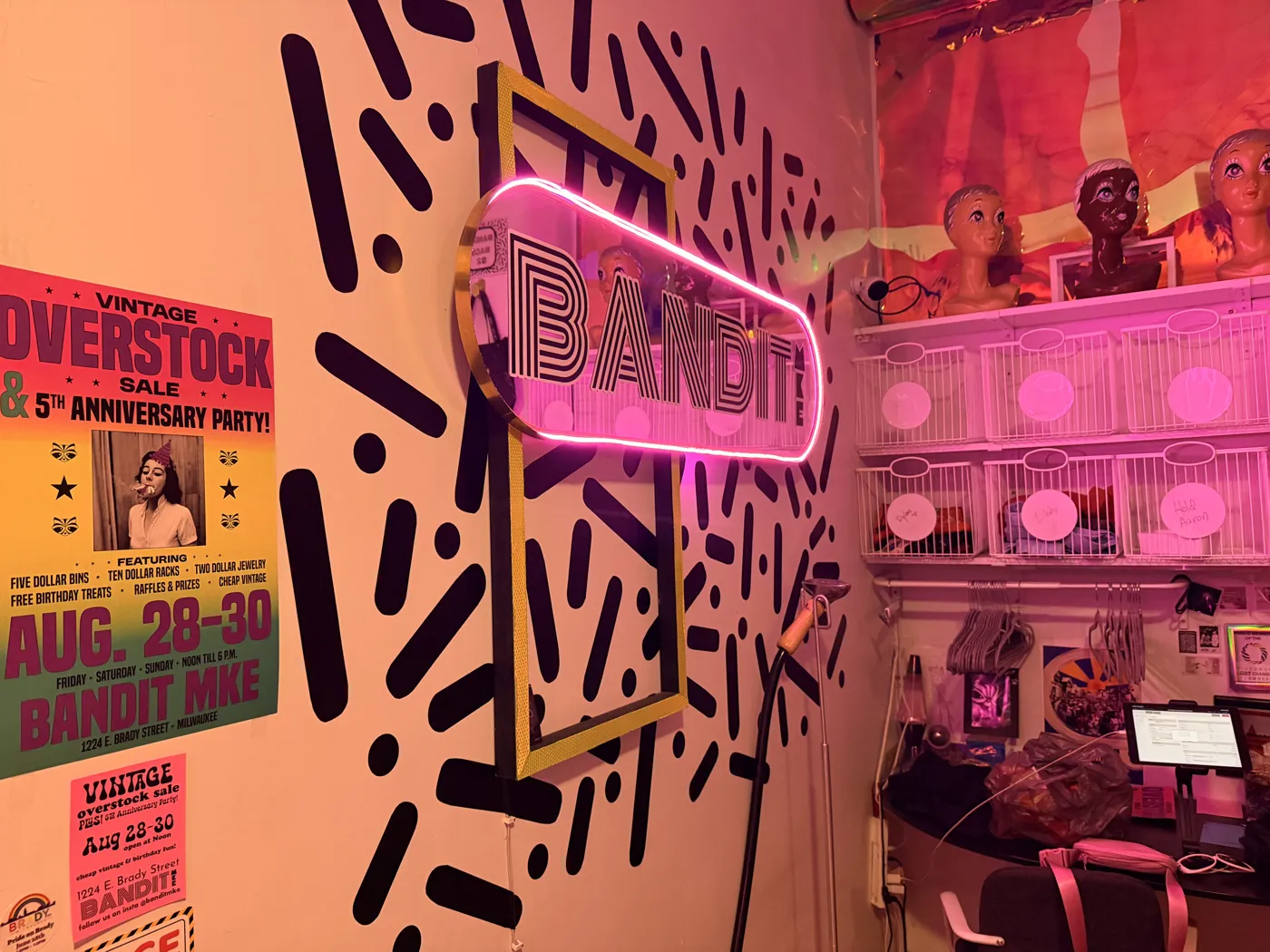 The pink Bandit neon sign inside the shop