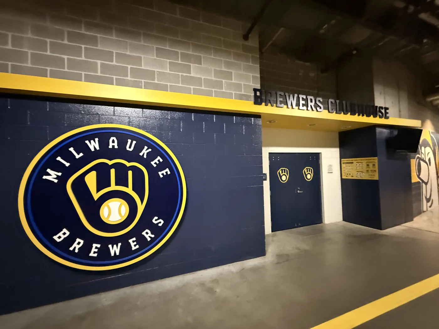 The Milwaukee Brewers ball-in-glove logo on the clubhouse wall