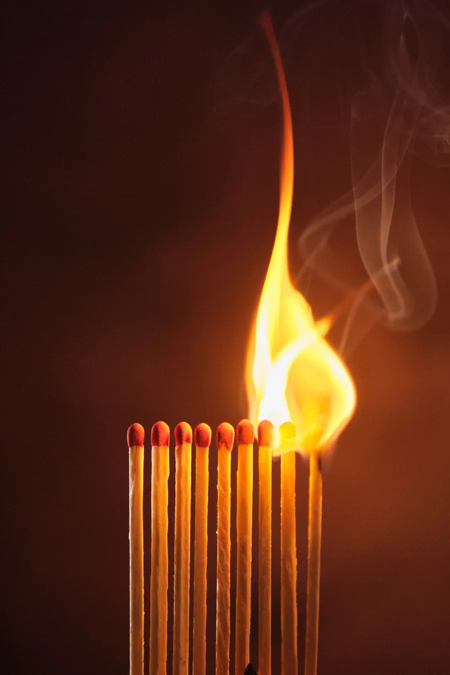 A row of matches catching fire